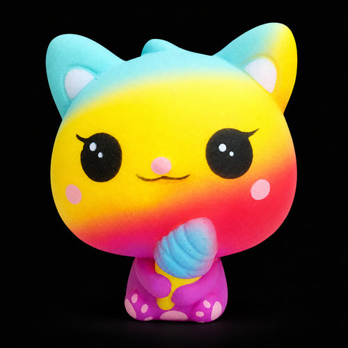 Rainbow Cosmic Creatures squishy holding a blue ice cream on a black background