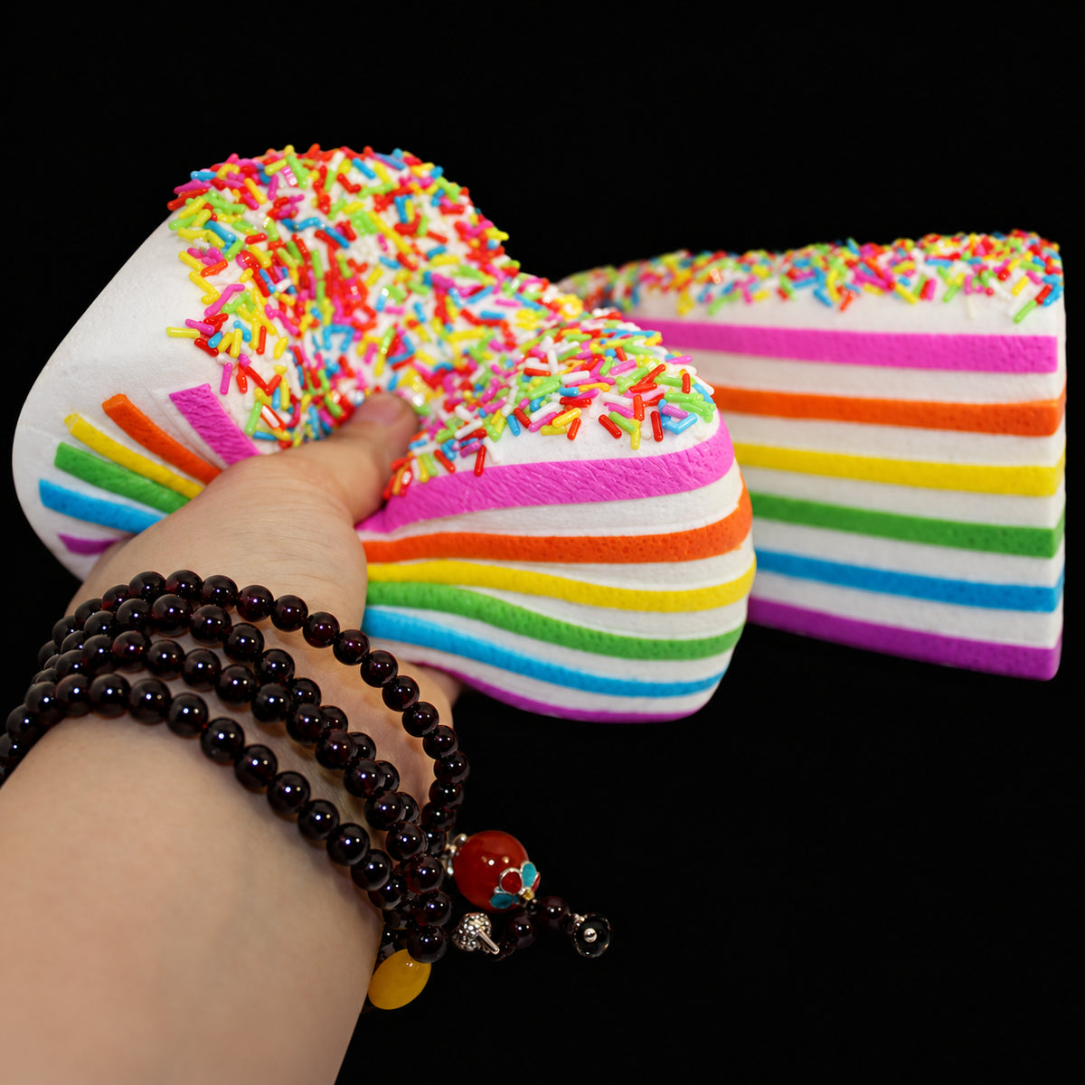 Rainbow Cake Squishy - Rainbow Sprinkles - original product photo on black